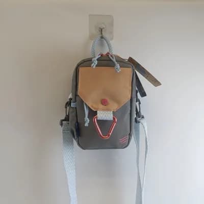 (R)evolution Daily Crossbody